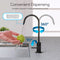 A hand washes a green apple under the Brio Modern Series Water Faucet – Matte Black, a lead-free stainless steel faucet with dual handles, splash-free tapered spout, 360° rotation, 90° lever movement, and a convenient modern design.