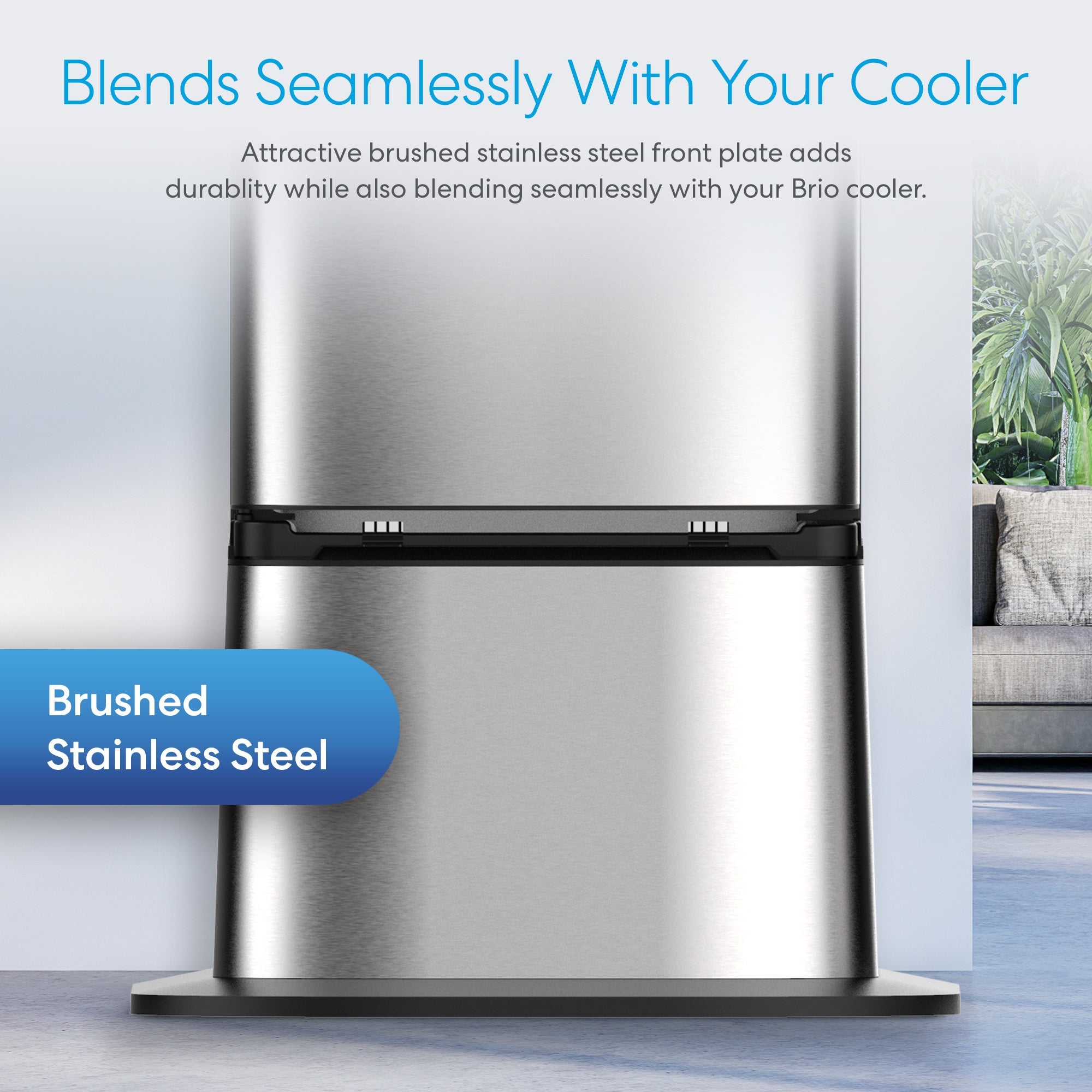 A stainless steel refrigerator in a room, complemented by a sleek Brio Water Cooler Base from the 300, 400, 500, or 700 Series nearby.