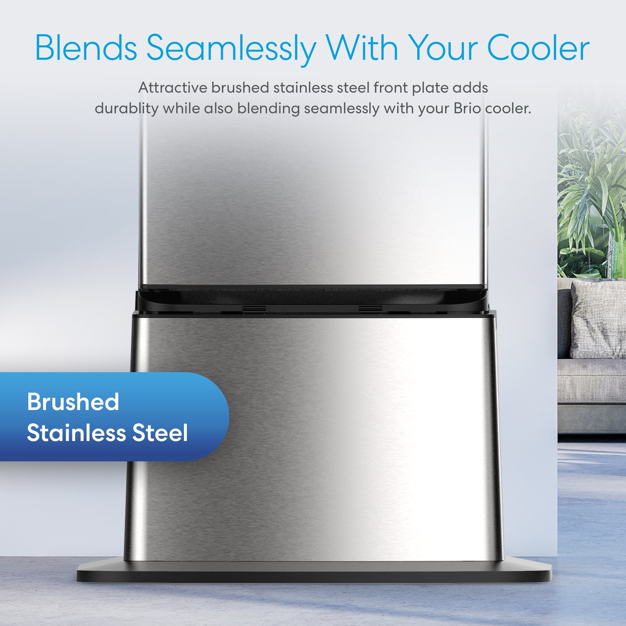 Close-up of the brushed stainless steel front plate on the Brio Water Cooler Base – 530 Series Bottled & Bottleless Water Cooler, showcasing its seamless design and durability. A couch and plant appear blurred in the background.