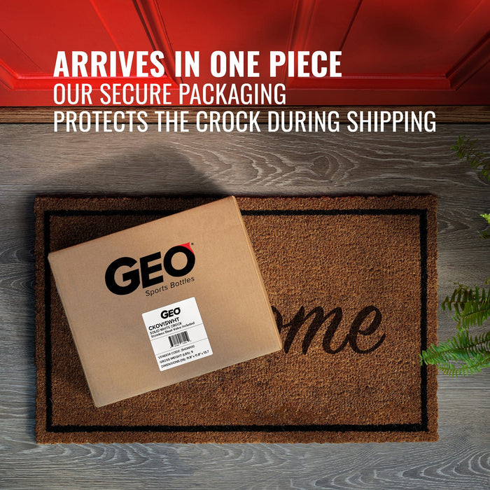 A box labeled GEO Porcelain Ceramic Crock Water Dispenser – Gold Chrome sits on a doormat by a red door. Text above: Arrives safely! Secure packaging protects your stylish, BPA-free dispenser during shipping.