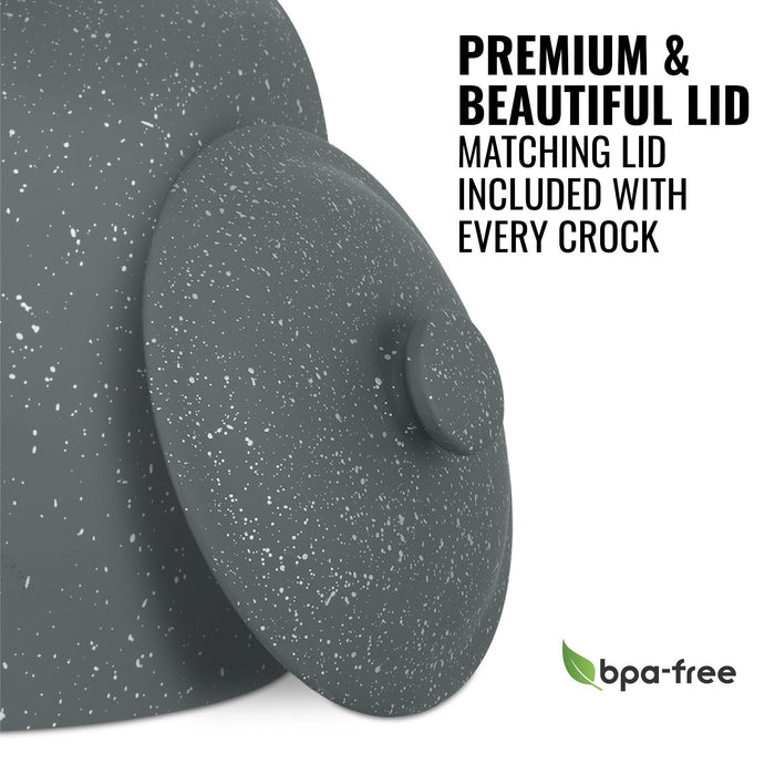 Close-up of the GEO Porcelain Ceramic Crock Water Dispenser in dark gray speckled finish, featuring a premium matching lid and BPA-free label with green leaf icon. Text: Premium & beautiful lid, matching lid included, BPA-free.
