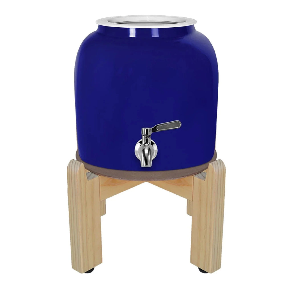 The GEO Porcelain Ceramic Crock Water Dispenser w/ Stand in blue features a BPA-free ceramic body, metal spigot, and wooden stand, displayed against a white background.