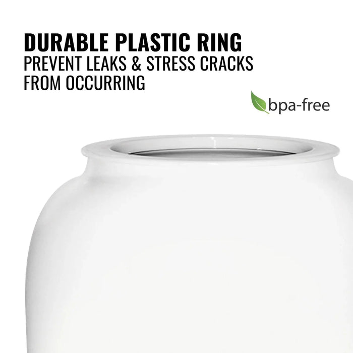 Close-up of the GEO Porcelain Ceramic Crock Water Dispenser w/ Stand – White shows a durable plastic ring that prevents leaks & stress cracks. Black text highlights this feature, and a green BPA-free label is visible on the water dispenser.