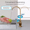 A hand washes a green apple under the Brio Curvy Classic Series Water Faucet – Brushed Bronze. The curved spout rotates 360° horizontally and 90° vertically, dispensing smoothly filtered reverse osmosis water at the sink.