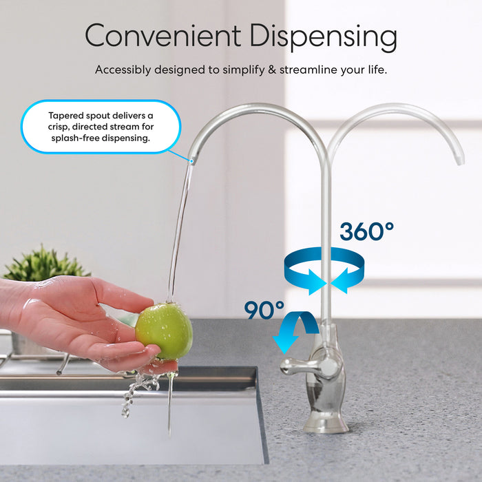 A hand rinses a green apple under the Brio Curvy Classic Series Water Faucet – Chrome, made from lead-free stainless steel. The faucet swivels 360° and tilts 90°, offering a splash-free stream ideal for reverse osmosis systems.