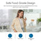 A woman smiles while drinking water in a modern kitchen. Text highlights that the Brio Curvy Classic Series Water Faucet – Chrome is crafted from food-grade, lead-free stainless steel and fits any reverse osmosis system. Icons stress safety and quality.