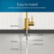 Diagram showing the Brio Modern Series Water Faucet – Brushed Gold being installed in a countertop, with labeled parts: rubber washer, locking clip, locking nut, 4" threaded shank, 1/4" quick connect, and 1/4" PE tubing. Easy to Install.