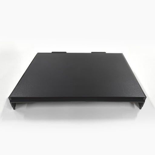 A black, rectangular Top Cover for Brio 320, 420 & 520 Series Icemaker Coolers with two tabs on the back edge, shown flat on a white surface against a plain white background.