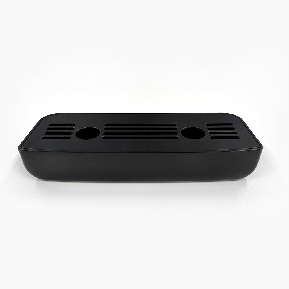 The Drip Tray and Cover 320S Black Slim Top Load is a black rectangular plastic tray with rounded corners, two circular holes, and multiple horizontal slits on top, designed for CLPOU320BSLUV2P, shown on a white background.
