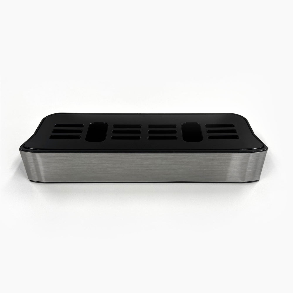 The Drip Tray and Cover 320S Stainless Slim Top Load is a stainless steel and black plastic tray with multiple vertical slots, designed for organizing utensils and compatible with CLPOU320SLUV2P water filter systems.