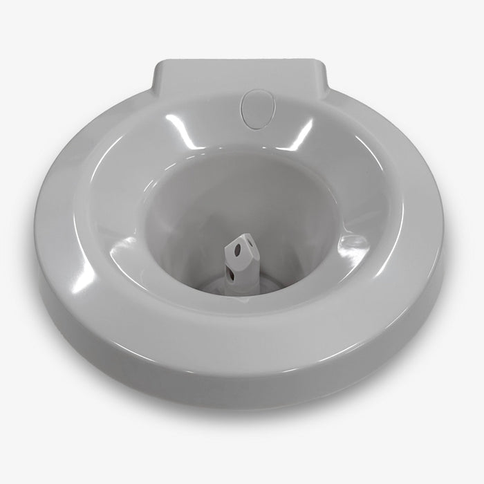 The Non-Spill Top 320 Slim White is a white plastic sitz bath designed to fit over a toilet seat, featuring a central water spout. It is compatible with CLPOU320WSLUV2P and CLTL320WSLP models and shown on a plain white background.