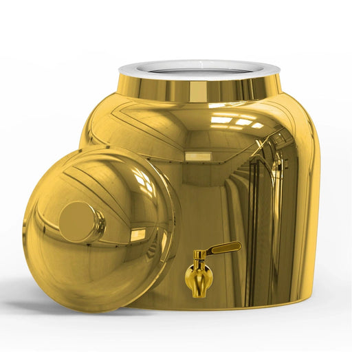 The GEO Porcelain Ceramic Crock Water Dispenser – Gold Chrome features a reflective gold finish, a BPA-free porcelain body resembling a 5-gallon bottle, with a spout near the bottom and lid beside it, catching light and reflections.
