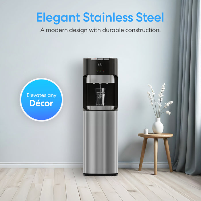 The Brio 400 Series Bottom Load Water Cooler features a sleek stainless steel design, enhancing any modern room with light wood floors and stylish décor, making it both elegant and functional.